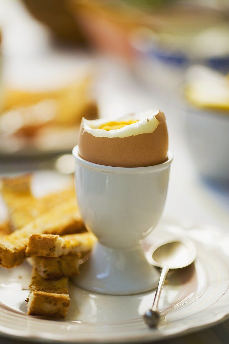 A boiled egg with toast soldiers