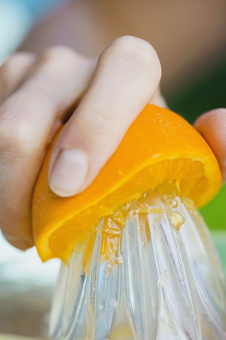 Squeezing half an orange