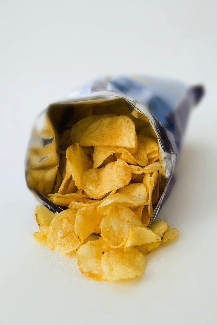 An open packet of potato crisps