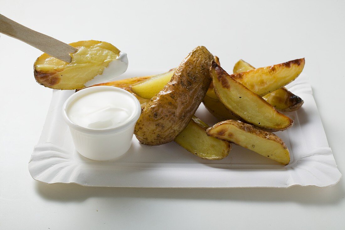 Baked potato wedges with sour cream