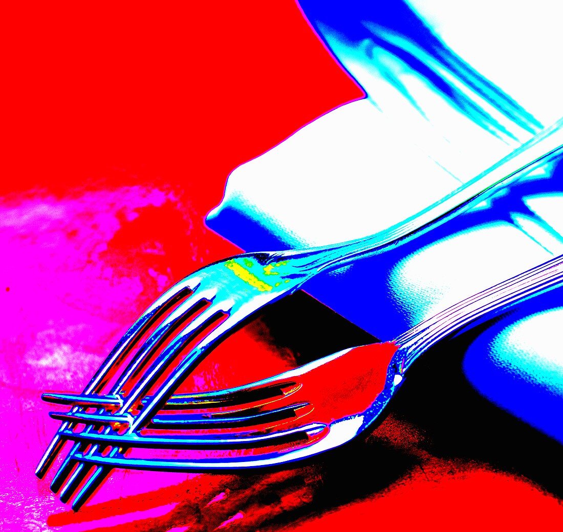 Two forks on a napkin