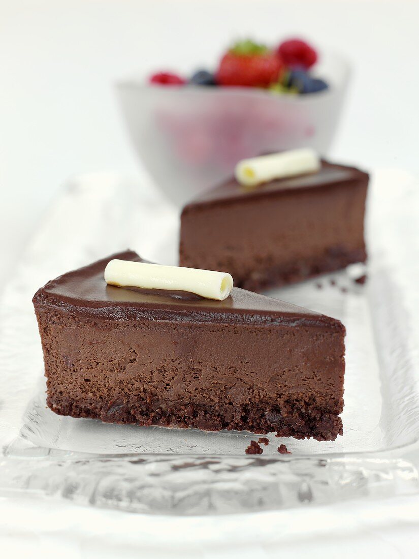 Two pieces of chocolate cheesecake