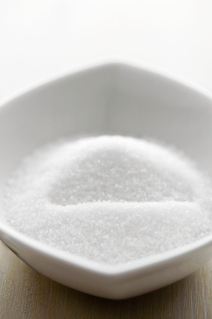 Sugar in a small white bowl