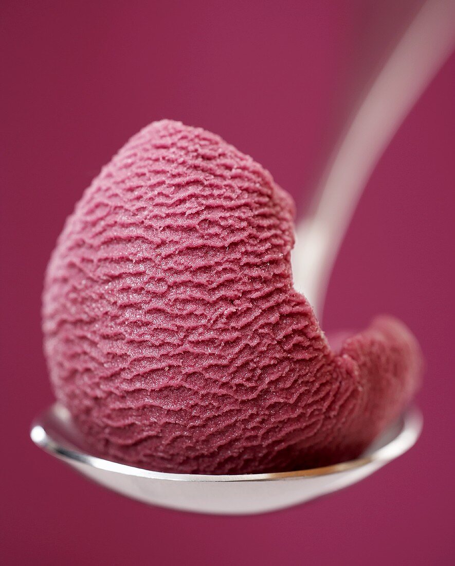Fruits of the forest sorbet on a spoon