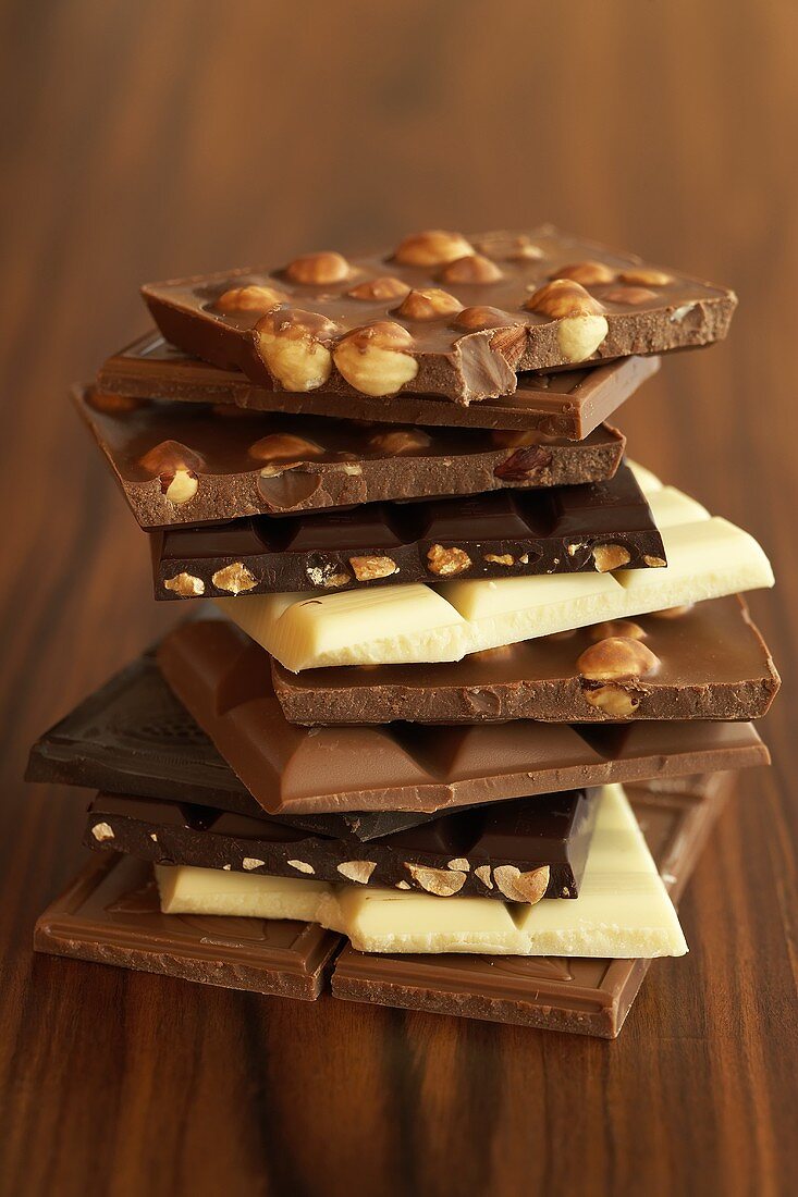 An assortment of chocolate bars in a pile