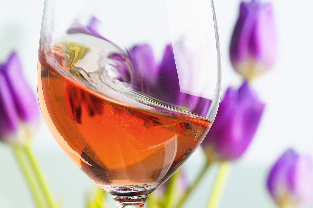 Rosé wine being swirled around in a glass
