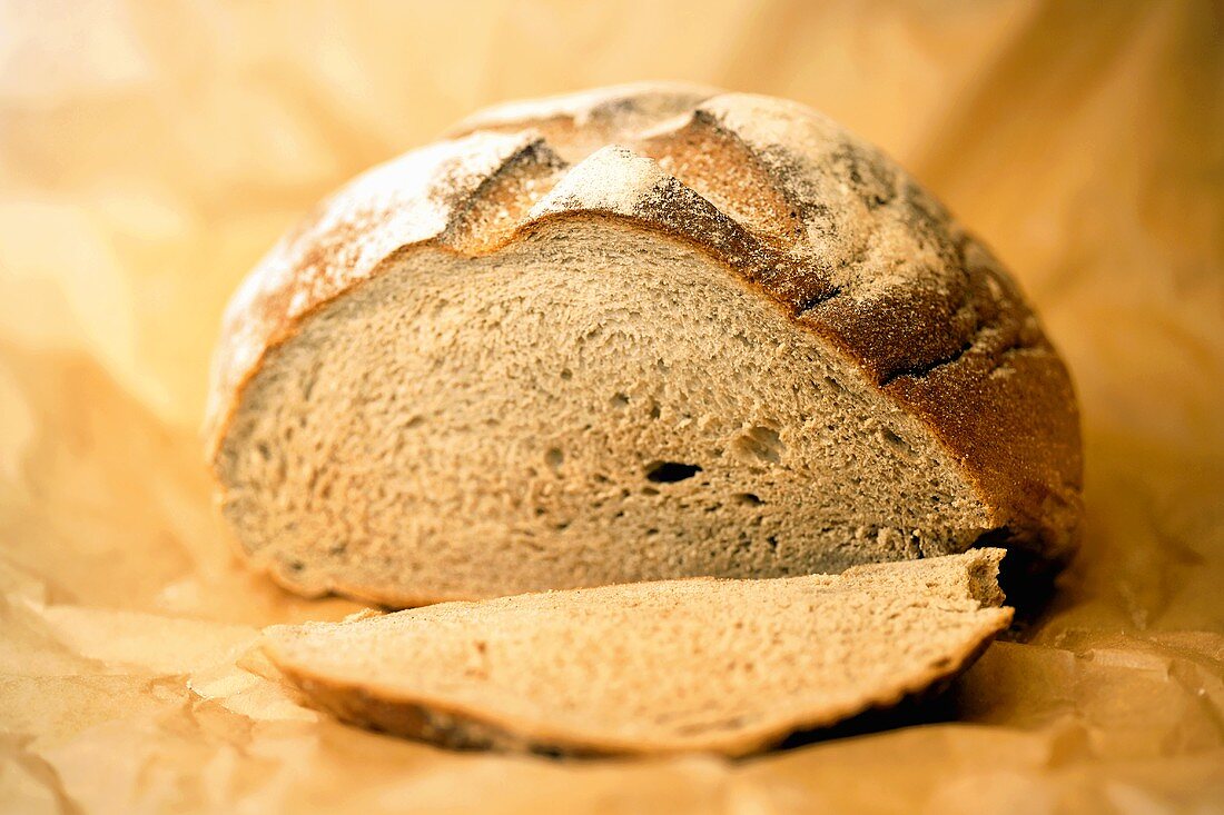 A loaf of barley bread, partly sliced