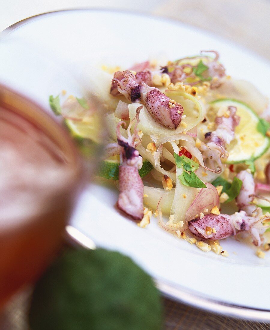 Green papaya salad with calamaretti and honey