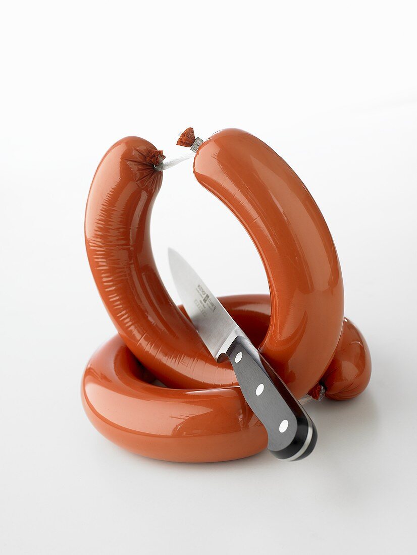 Two ring bolognas with knife