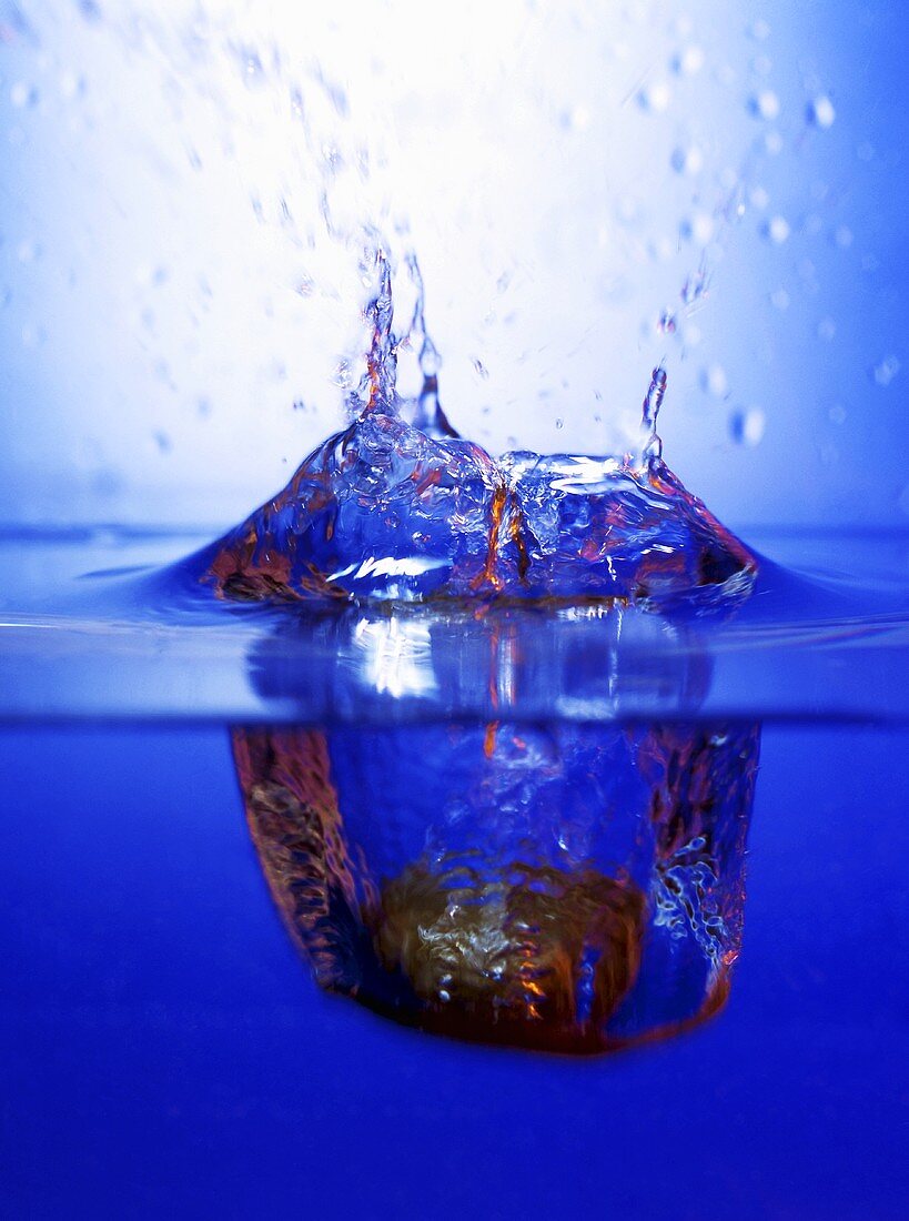 A stone falling into water