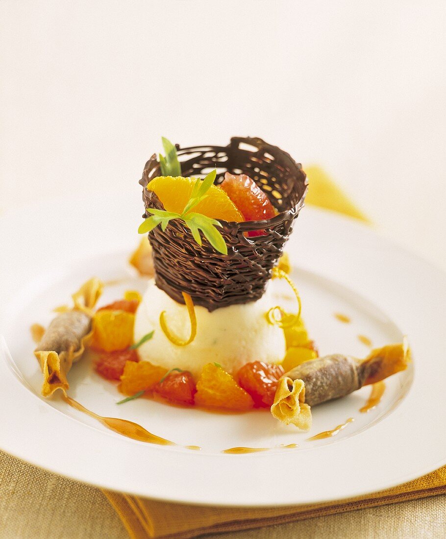 Fruit in chocolate basket on lemon sorbet