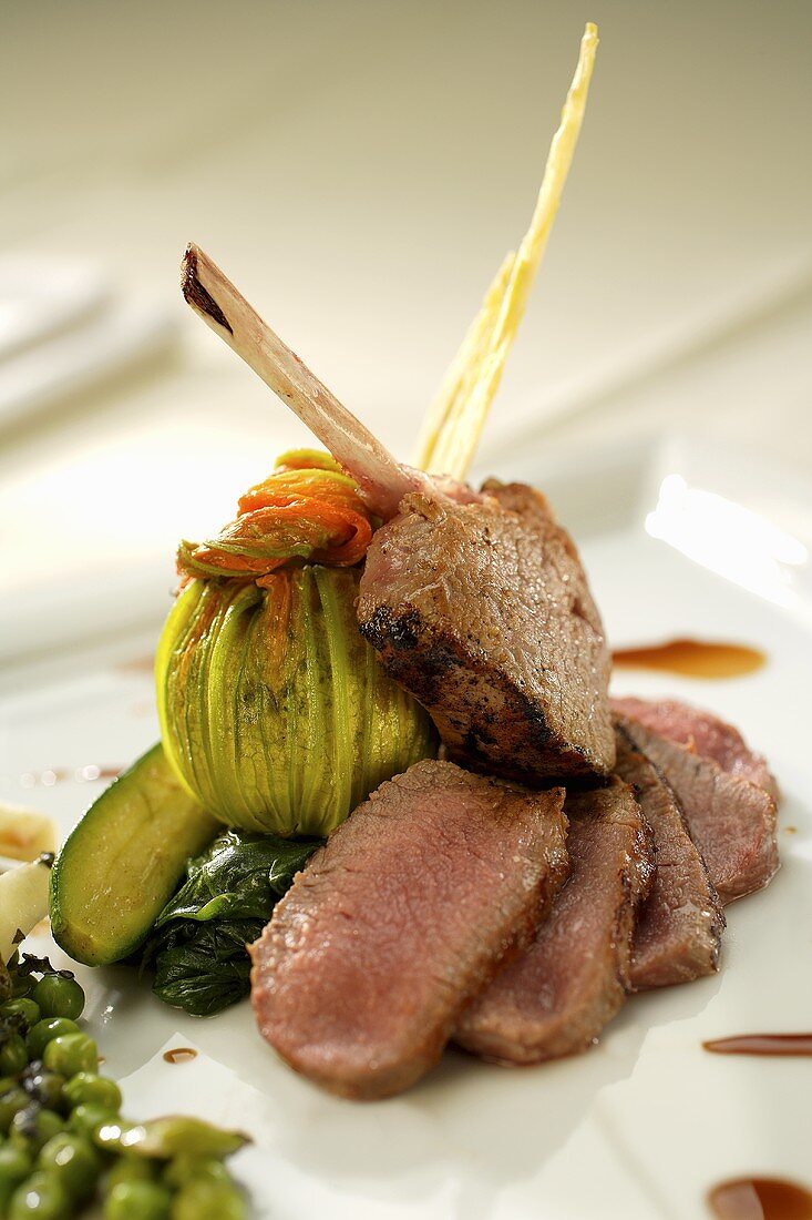 Roast lamb with spinach and courgettes