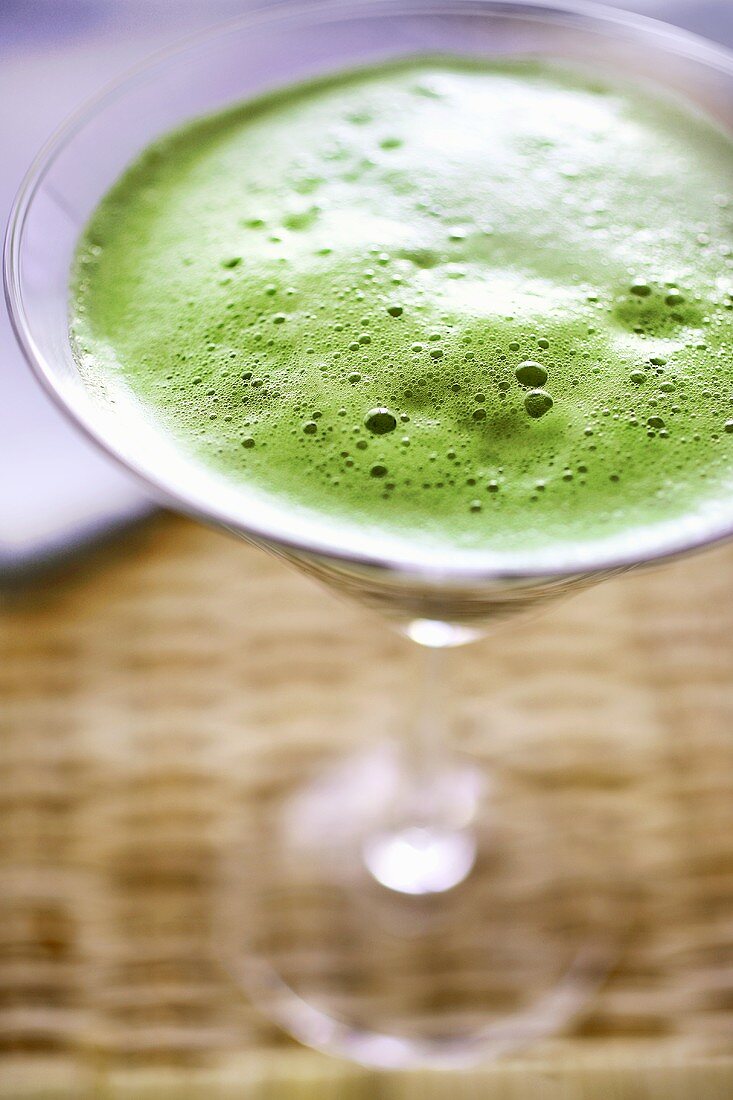 Green barley grass extract in a Martini glass