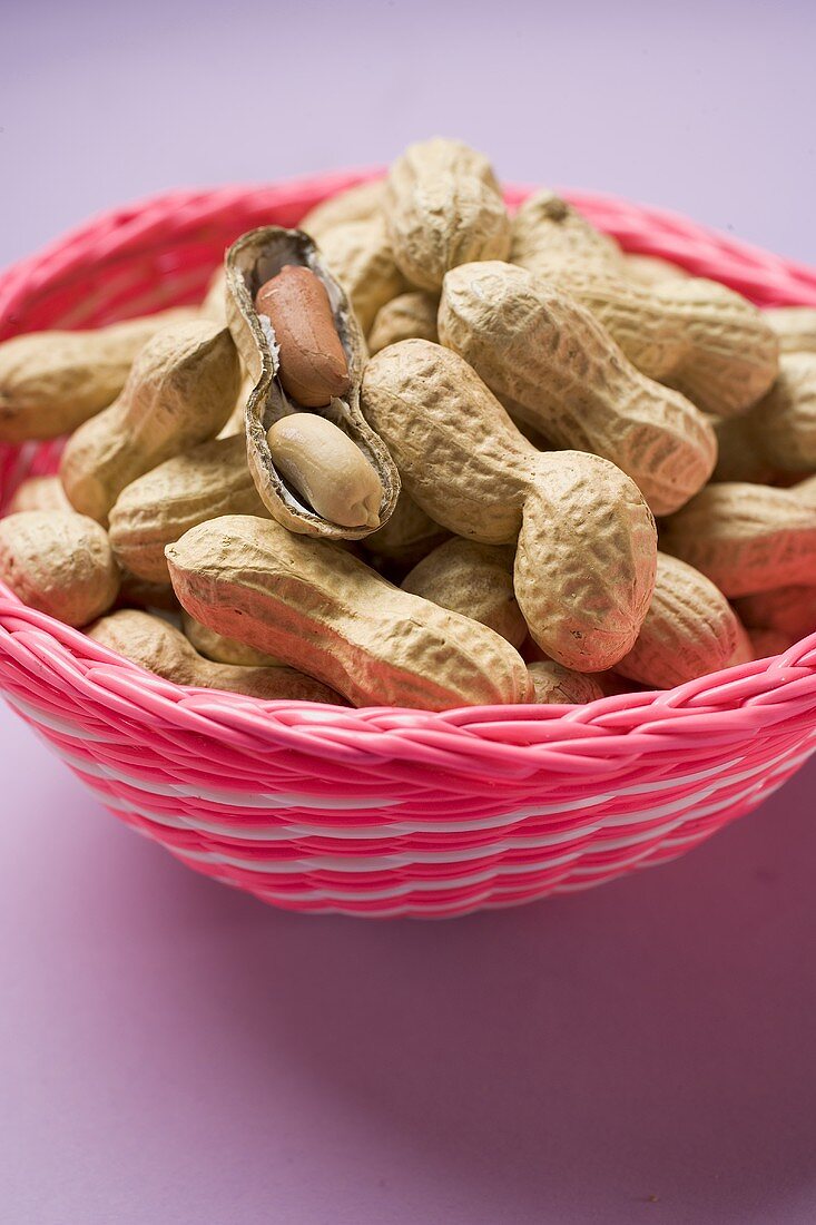 Several peanuts in a basket