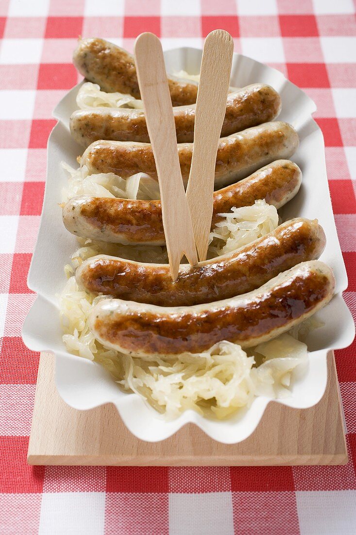 Sausages and sauerkraut in paper dish