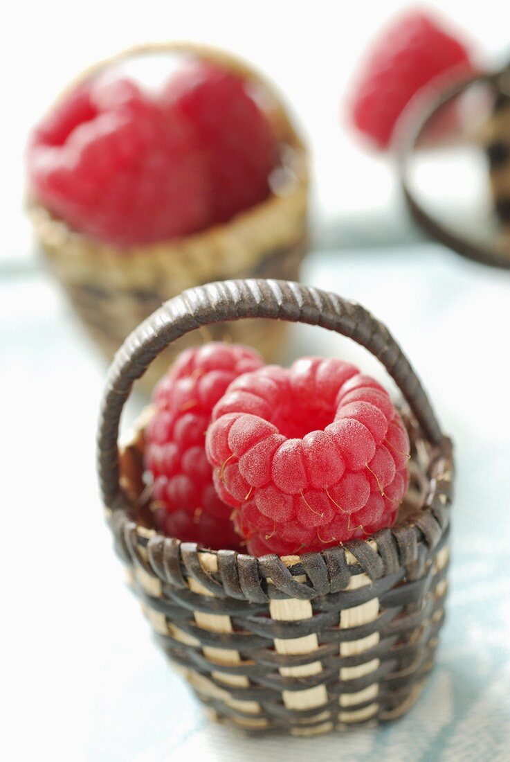 Raspberries in tiny baskets