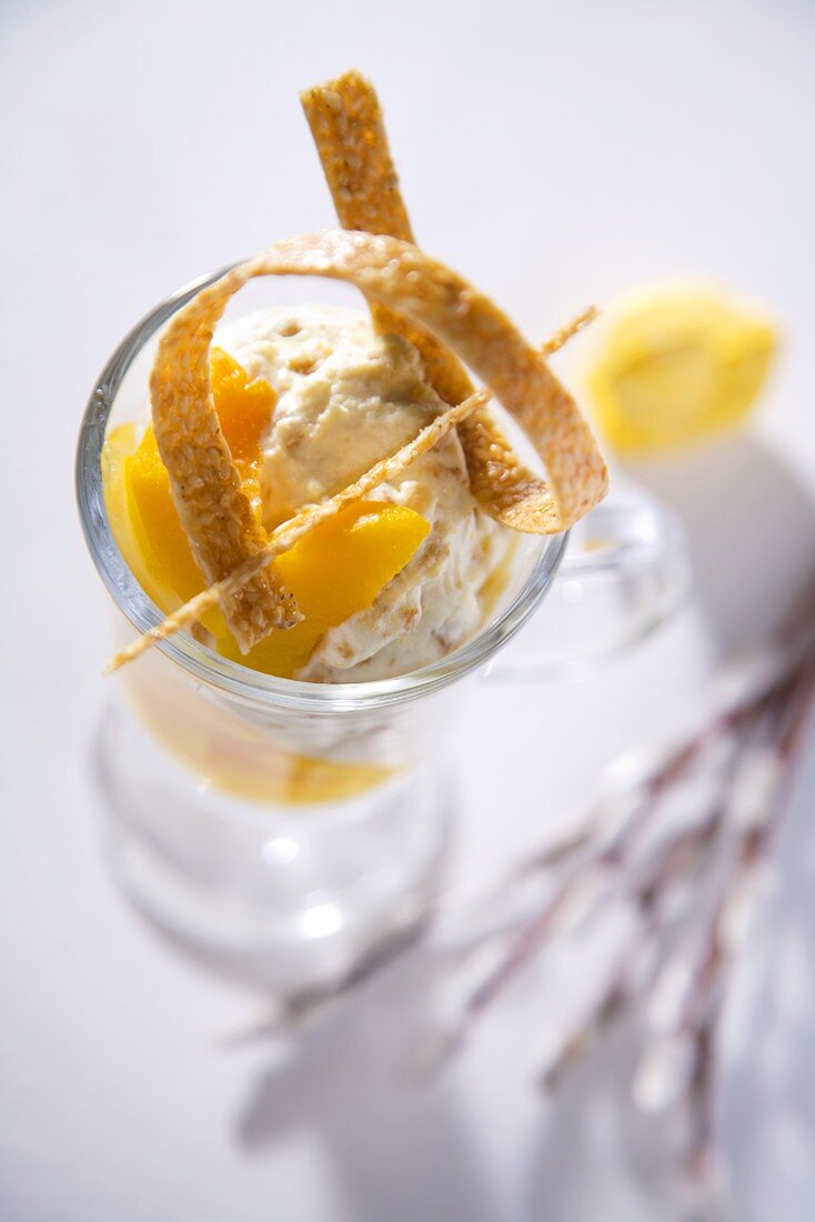 Mascarpone with peaches and sesame strips