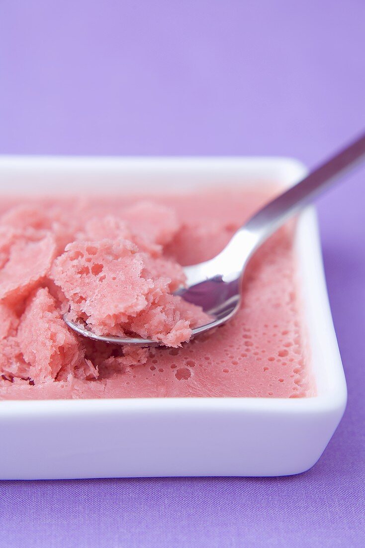 Strawberry parfait in dish with spoon