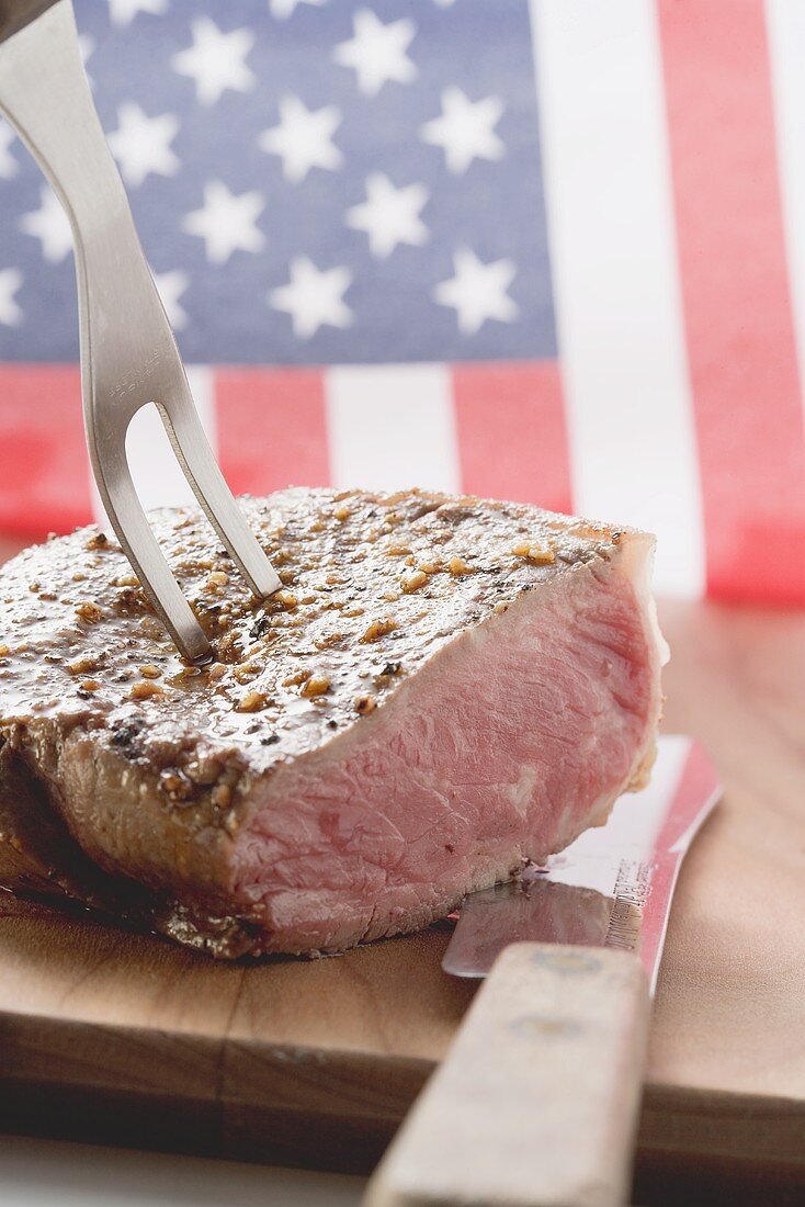 Beef steak on carving fork (USA)
