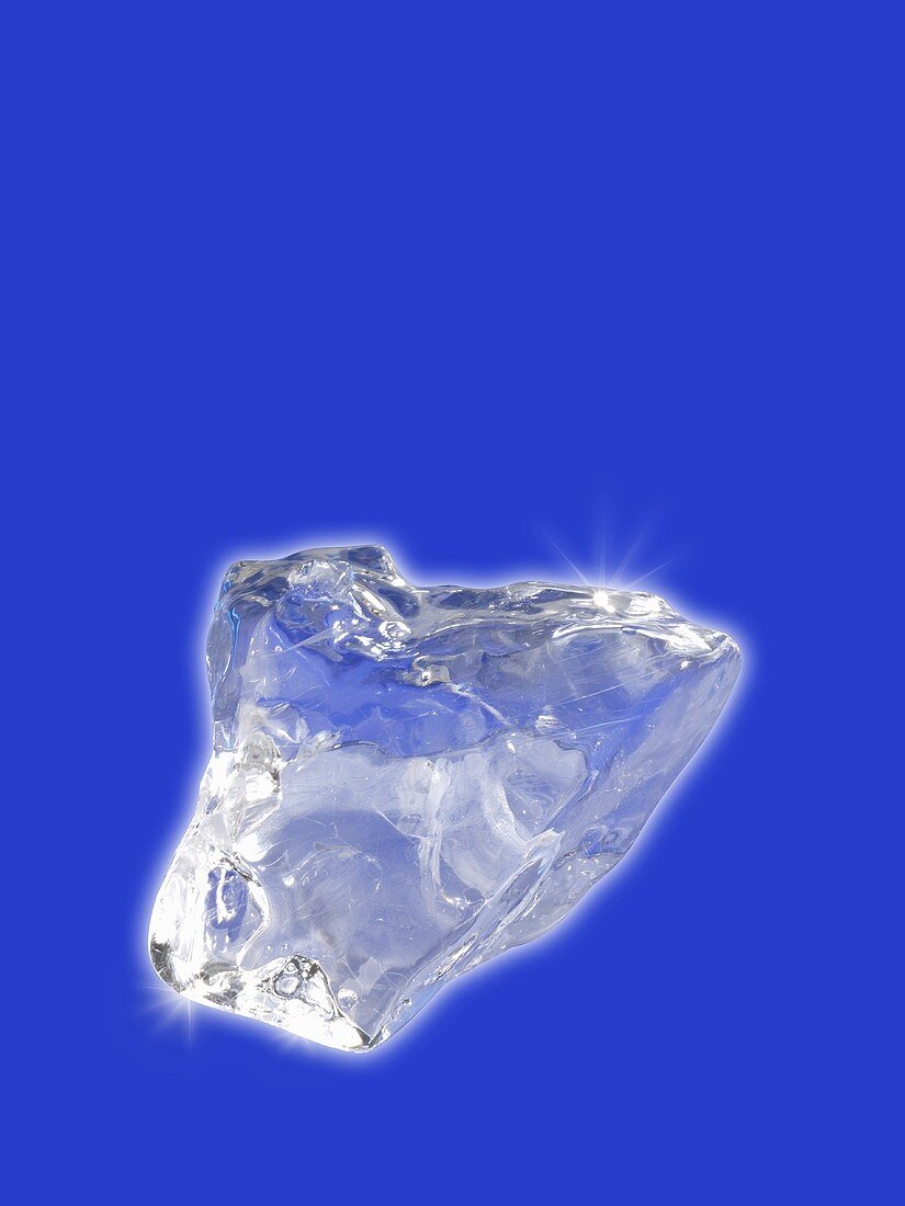 An ice cube on a blue background