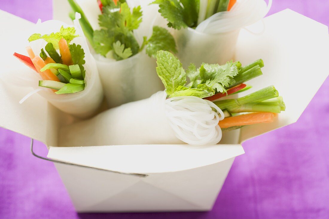 Rice paper rolls with vegetable filling in take-away container