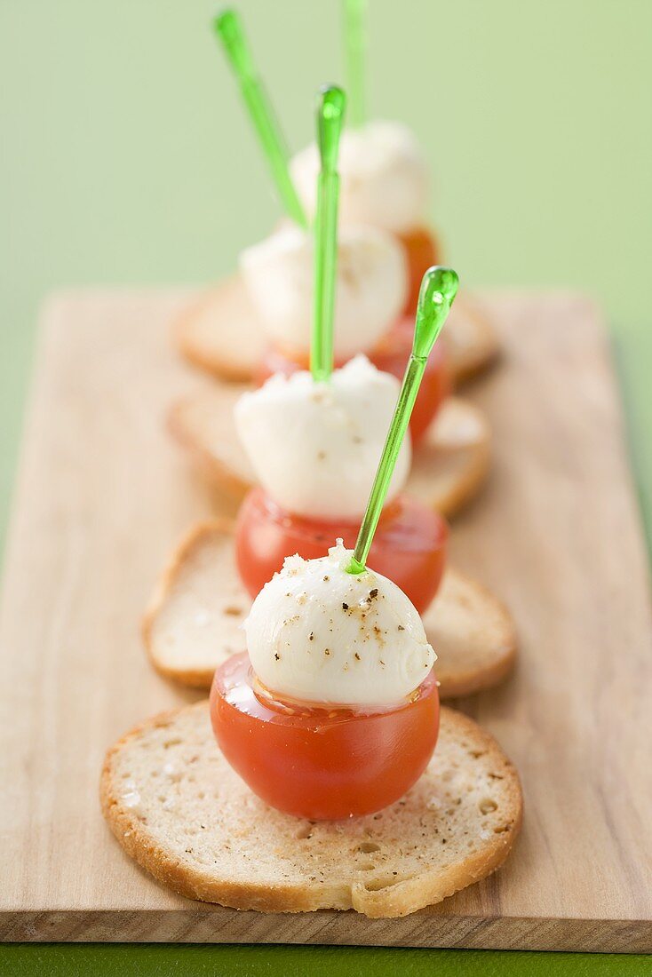 Cherry tomatoes with mozzarella on toasted white bread