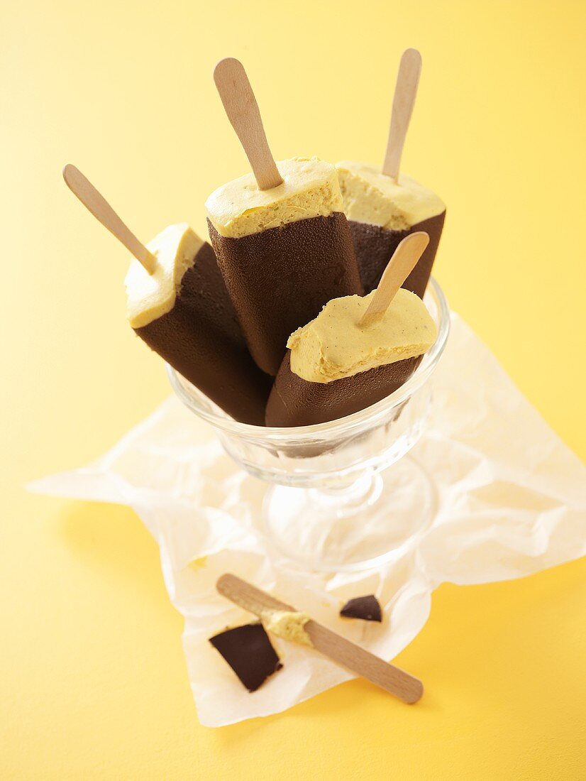 Chocolate-coated banana ice cream lollies