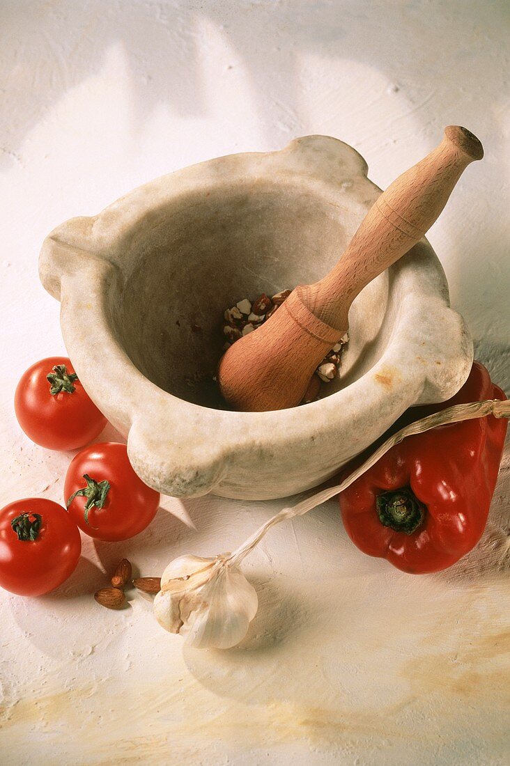 Tomatoes; peppers; garlic; almonds and mortar