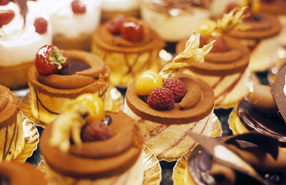 An assortment of small cakes in a patisserie
