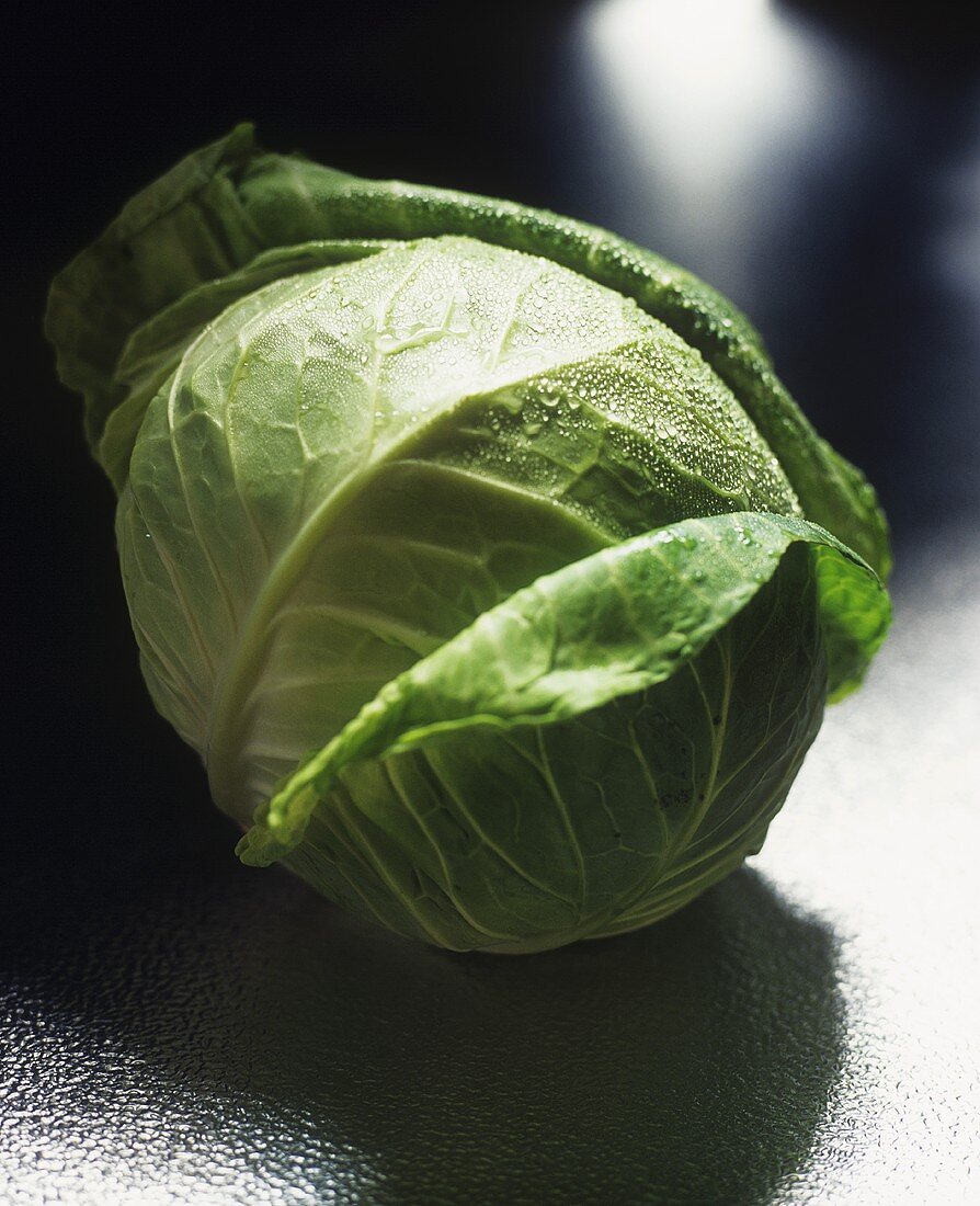 A cabbage with drops of water