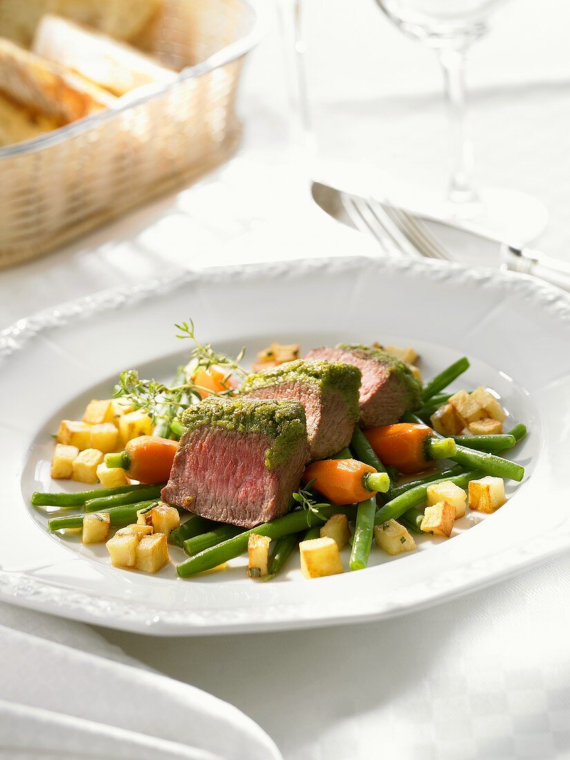 Loin of lamb with herb crust and vegetables