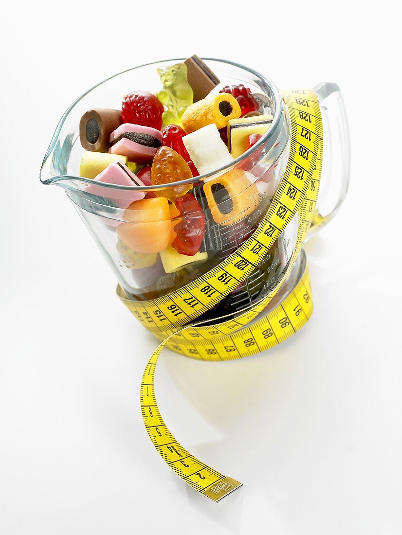 A glass jug full of sweets