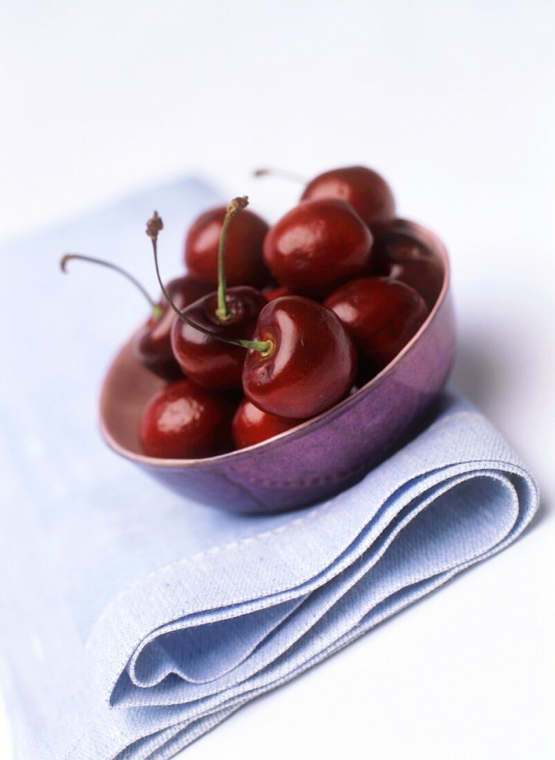 A small dish of cherries (can also represent wine bouquet)