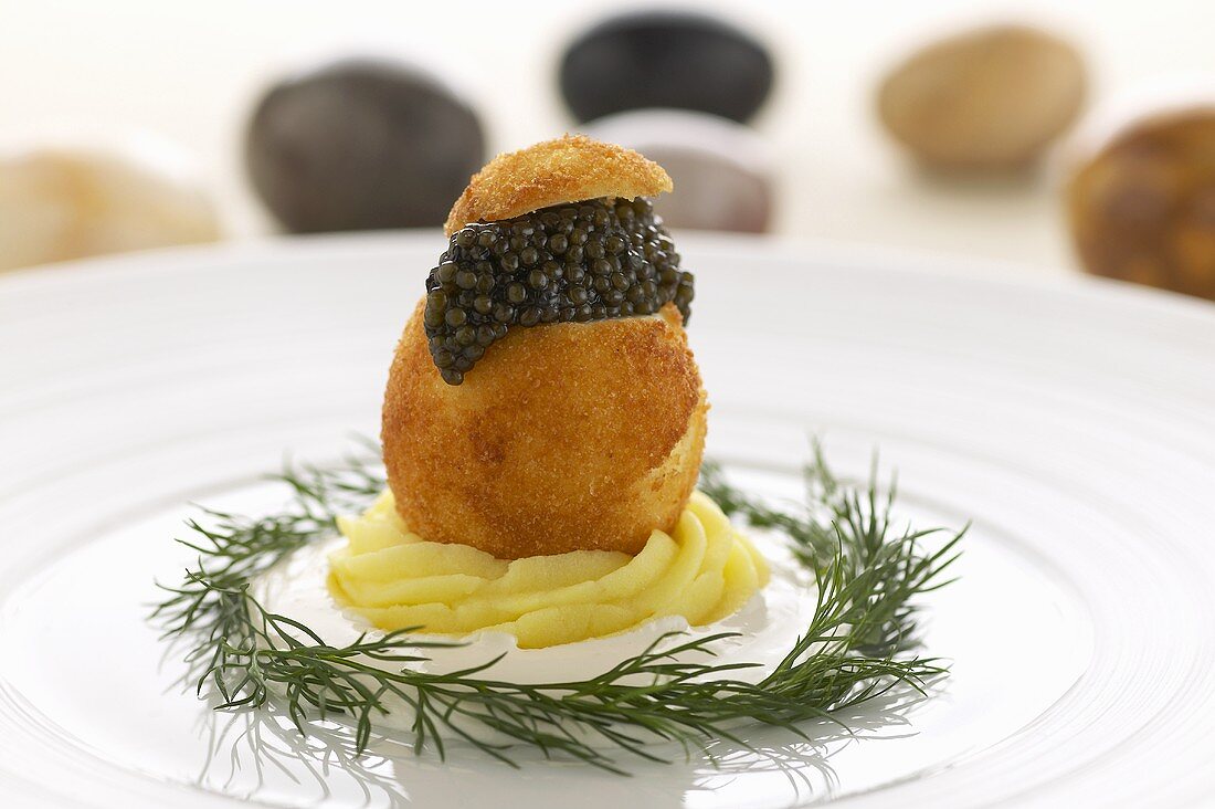 Crumb-coated fried boiled egg with caviar