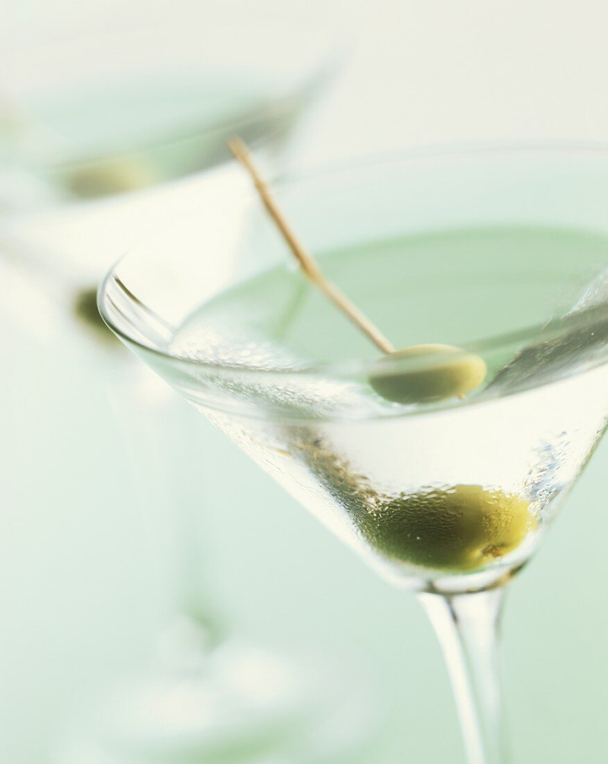 Martini with green olive