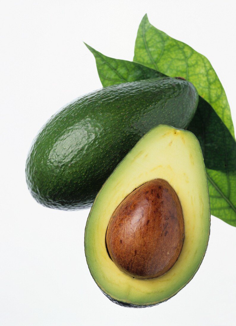 Avocado with stone and leaf
