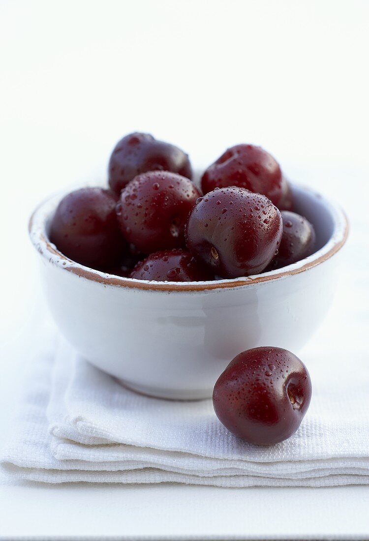 Several Spanish Picota cherries in a small bowl