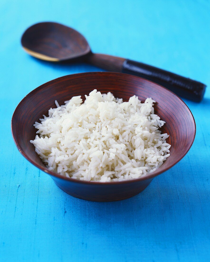Cooked basmati rice in a wooden dish