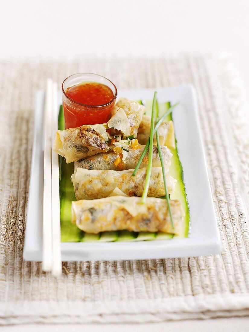 Five spring rolls filled with vegetables and herbs