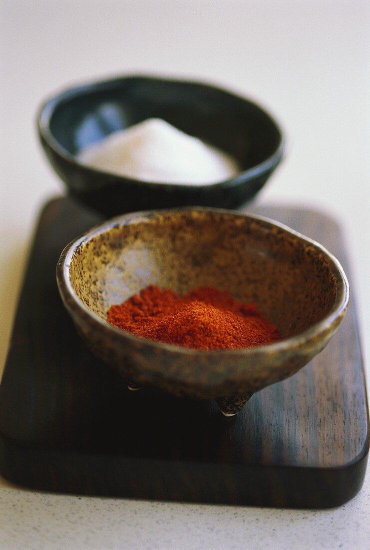 Two dishes of paprika and salt