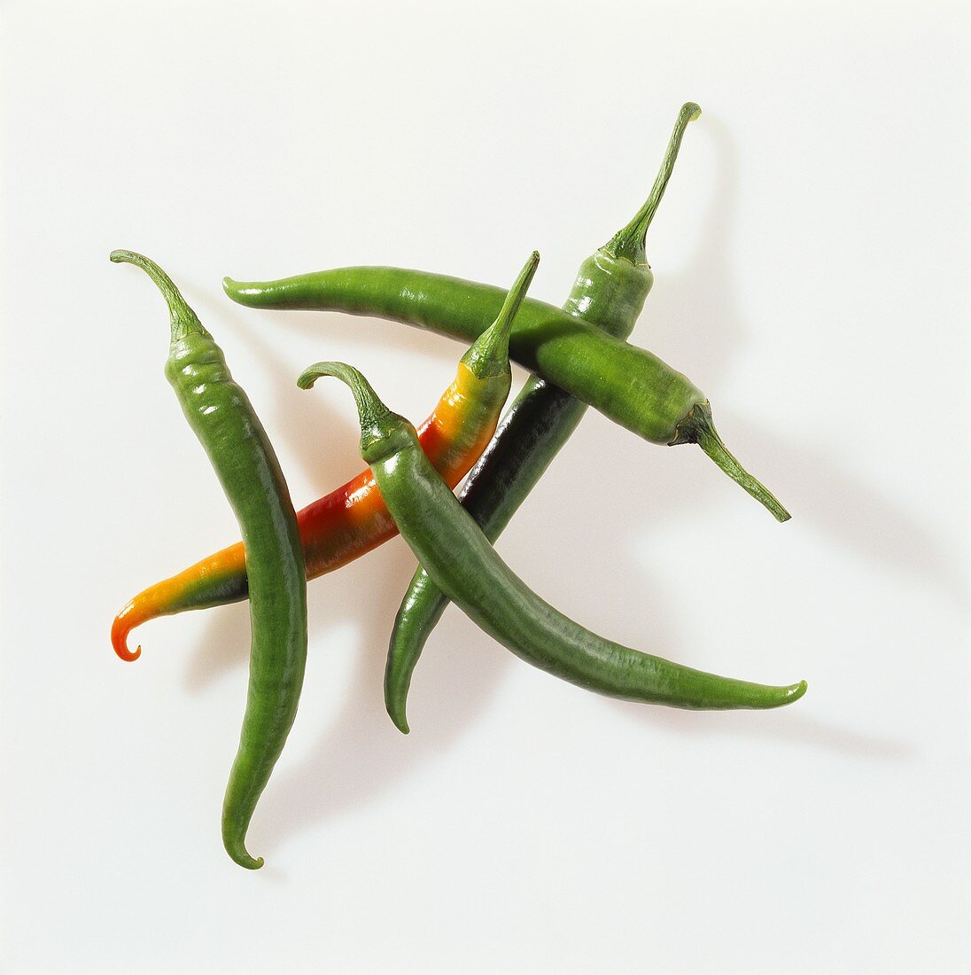 Several green chili peppers