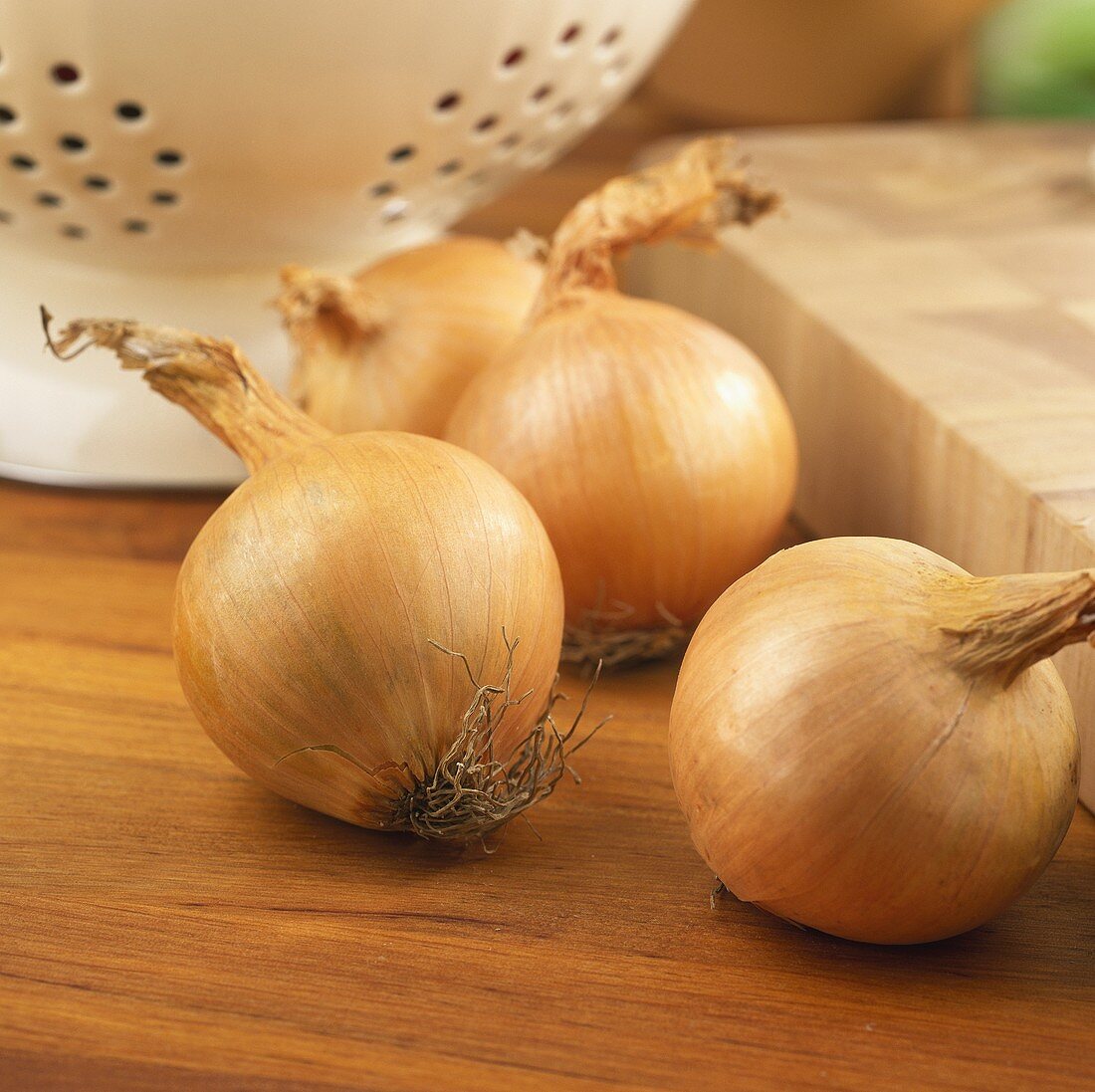 Four onions in a kitchen