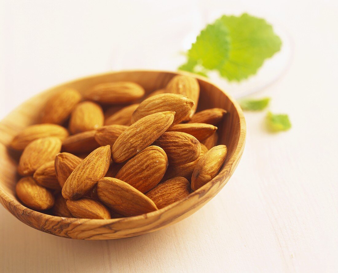 Almonds in a small wooden bowl