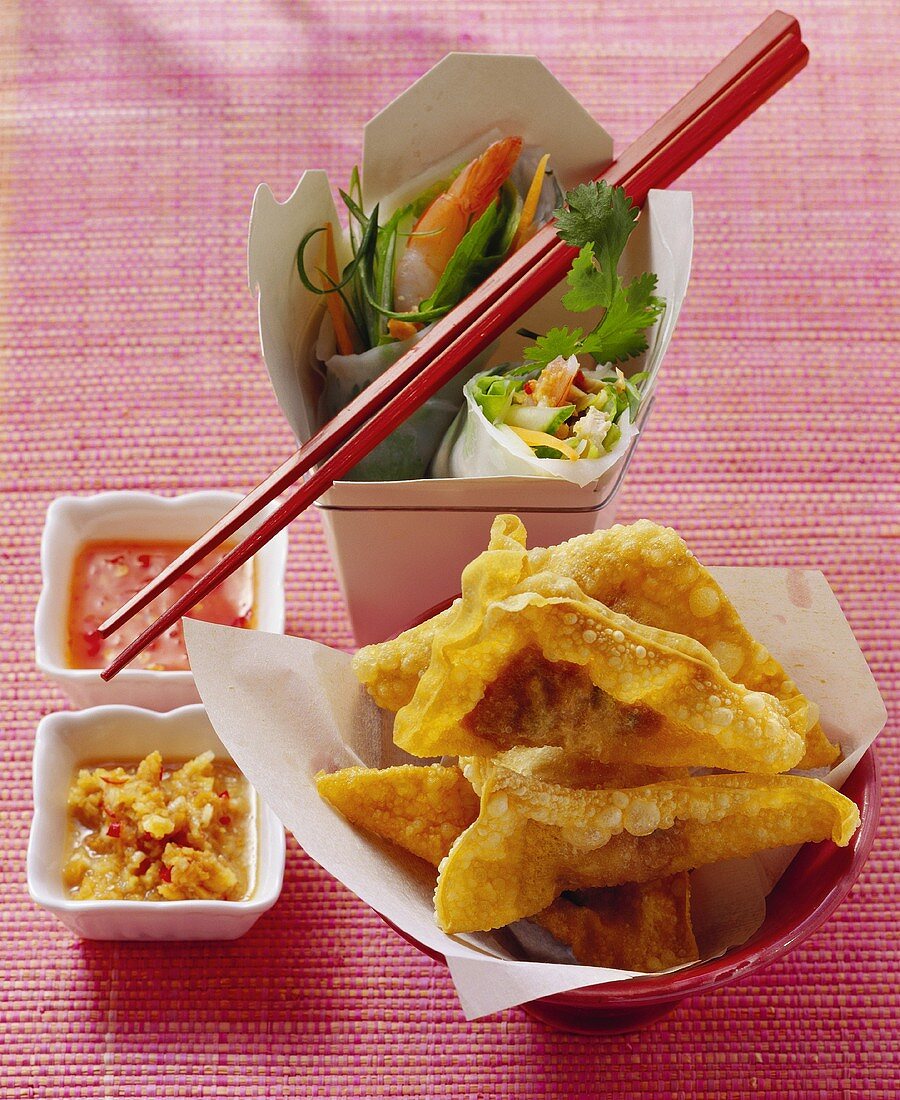 Deep-fried won tons and lucky rolls with dips
