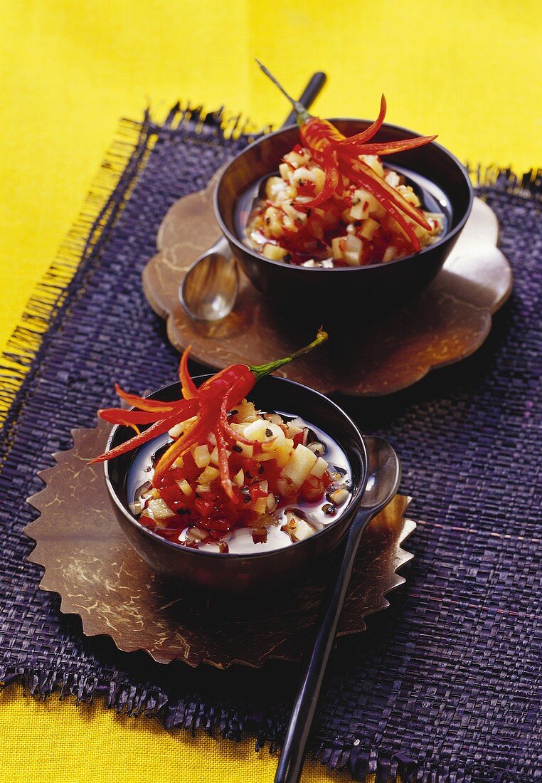 Two bowls of spicy chili and ginger relish