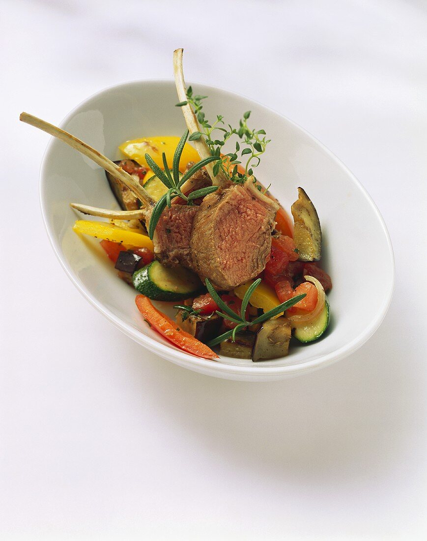 Saddle of lamb on bed of vegetables