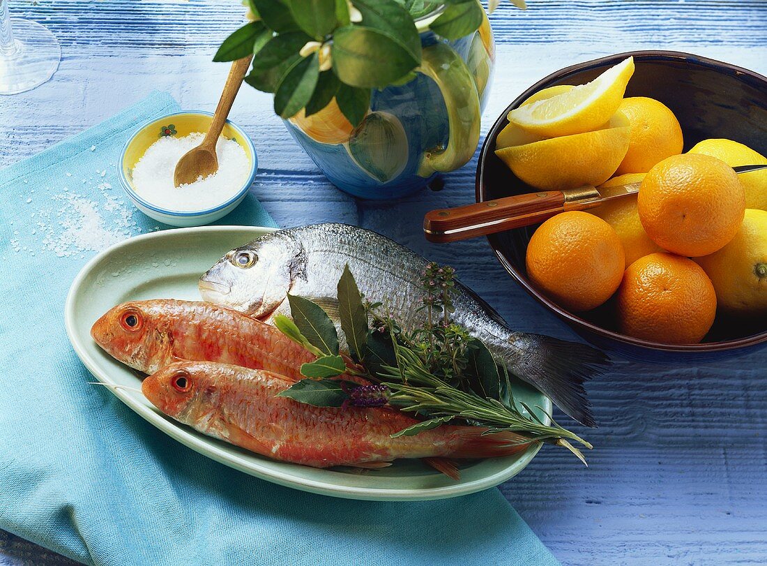 Red mullet and sea bream with salt, herbs and citrus fruits