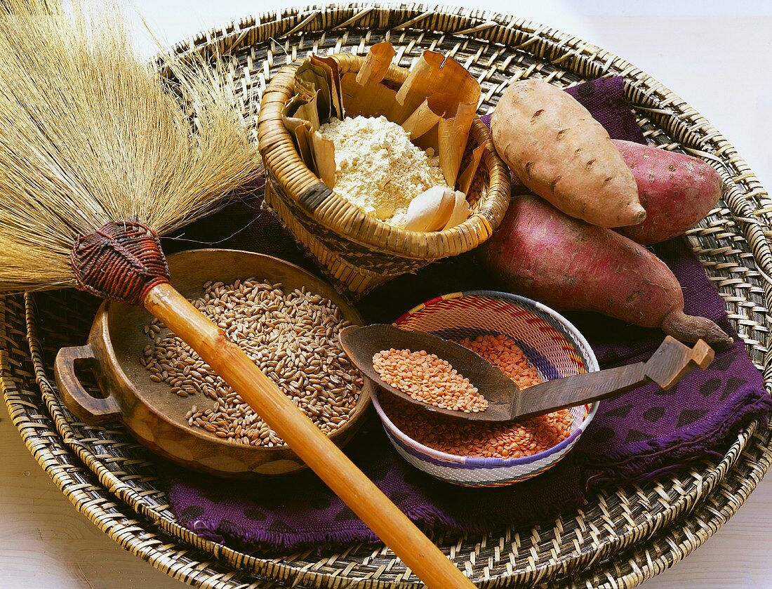 Still life with lentils, cereals, flour & sweet potatoes