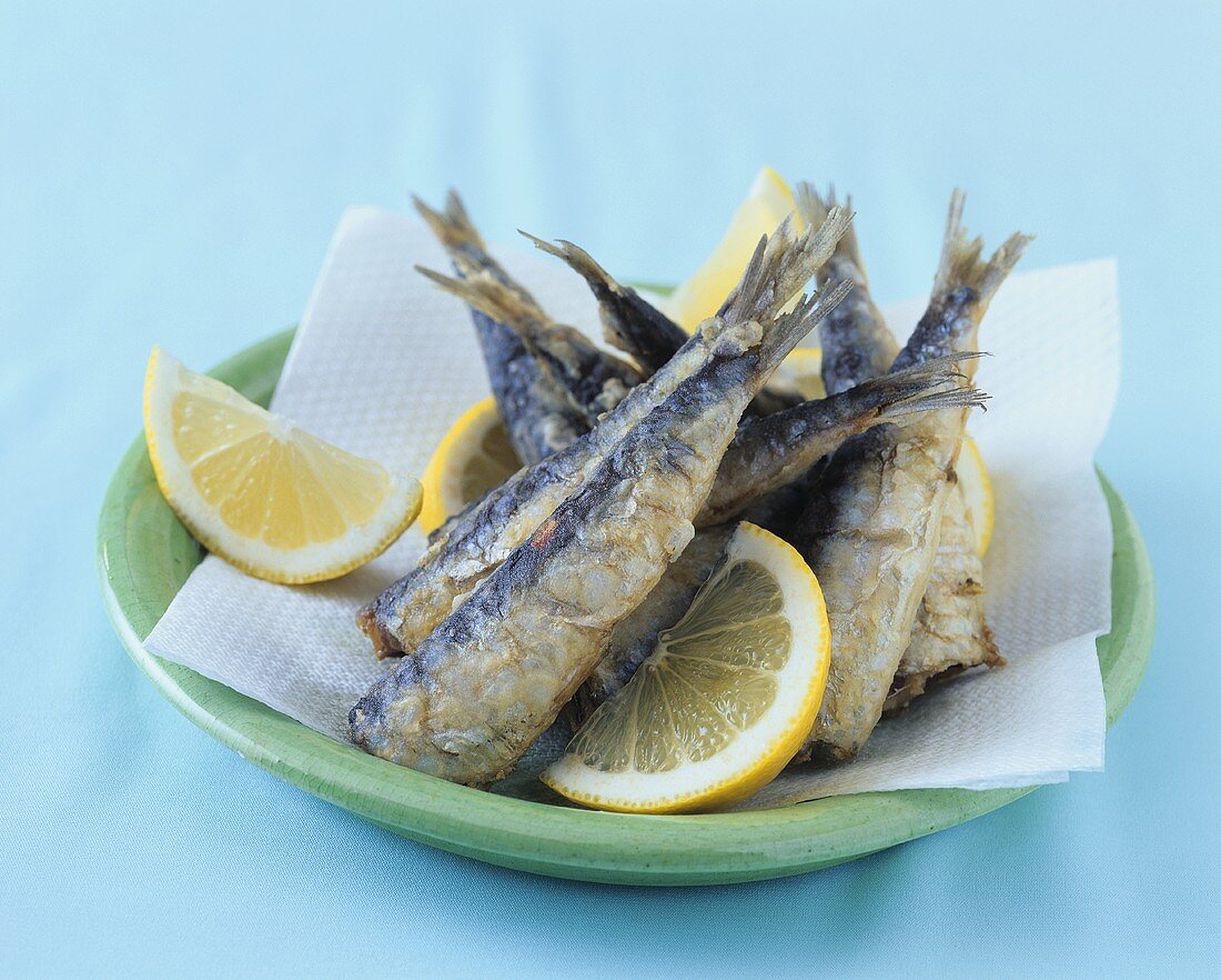 Several deep-fried anchovies on a plate
