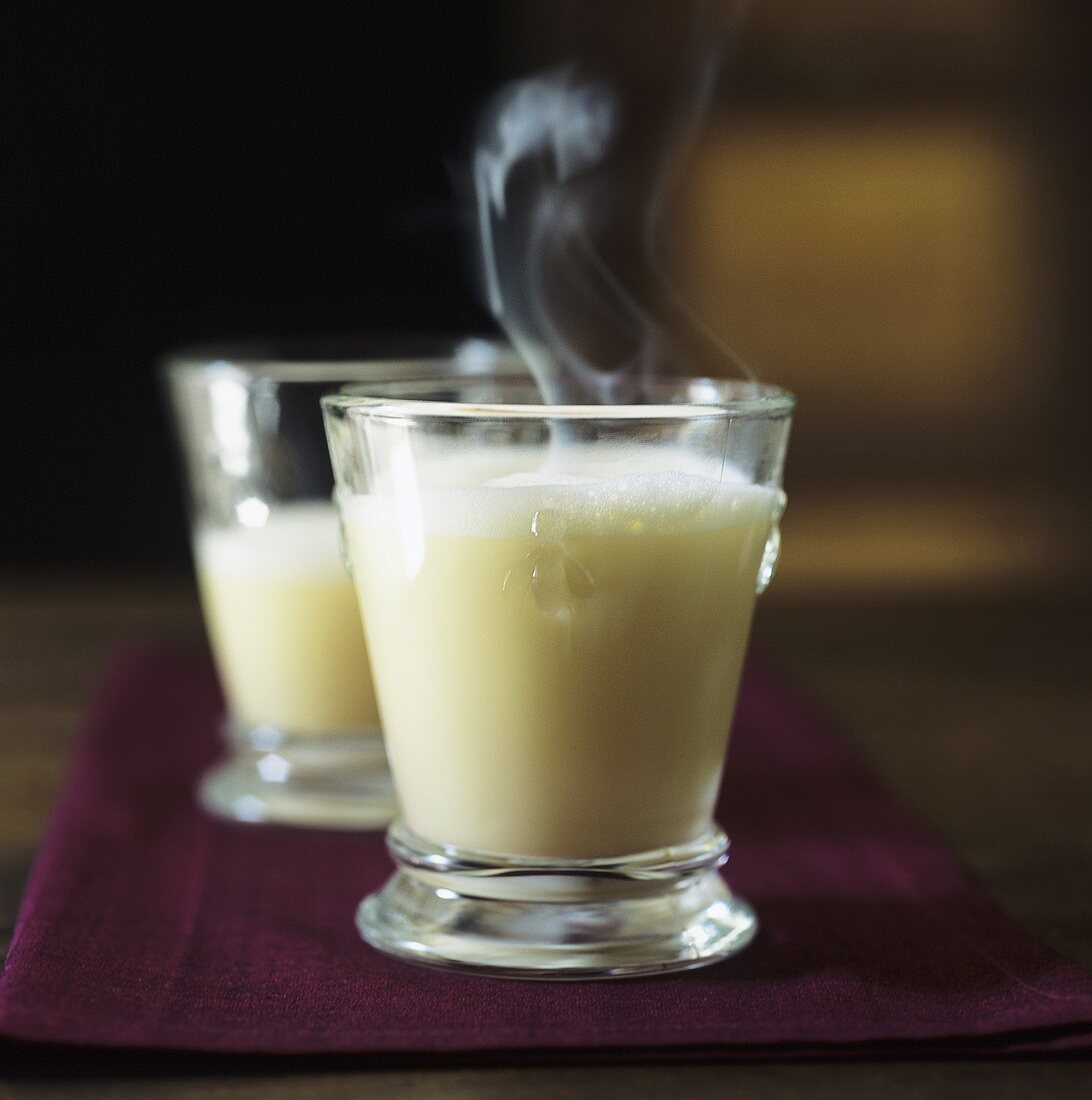 Two glasses of advocaat with hot milk and cream